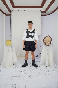Puffed sleeve shirt, monster scale shorts, and circle puzzle vest